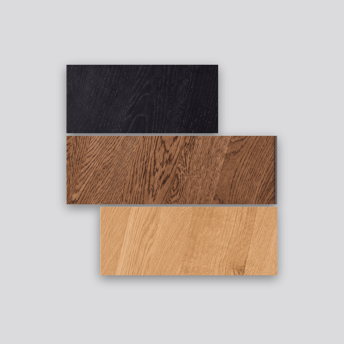 FUKUI oak finish samples — three solid oak planks in Natural, Brown and Black